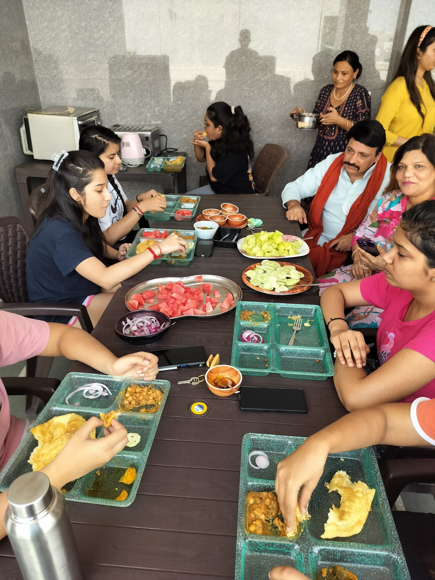 Residents sharing a meal together at Paper Pencil PG