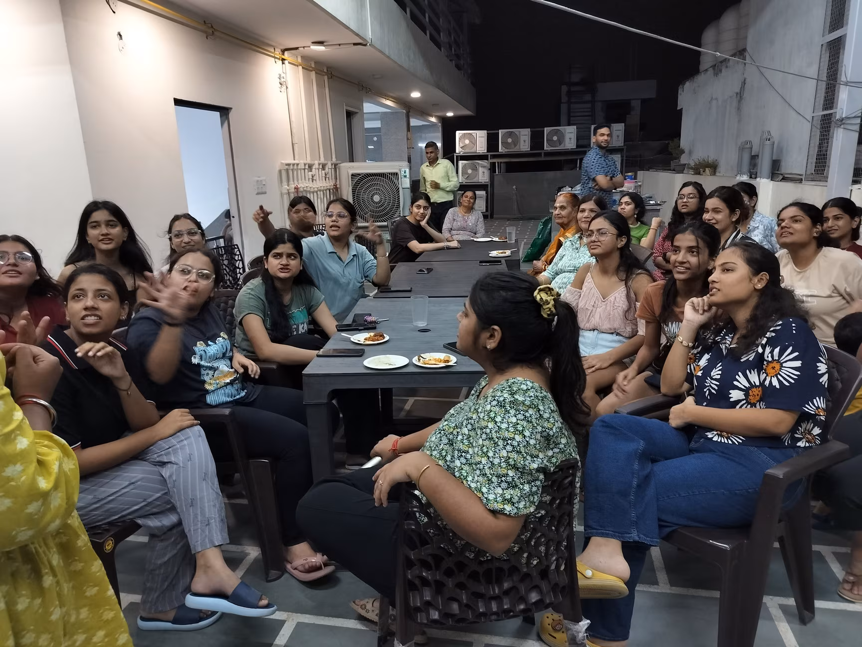 Residents spending time together at Paper Pencil PG